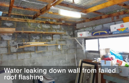 Water leaking down wall from failed roof flashing